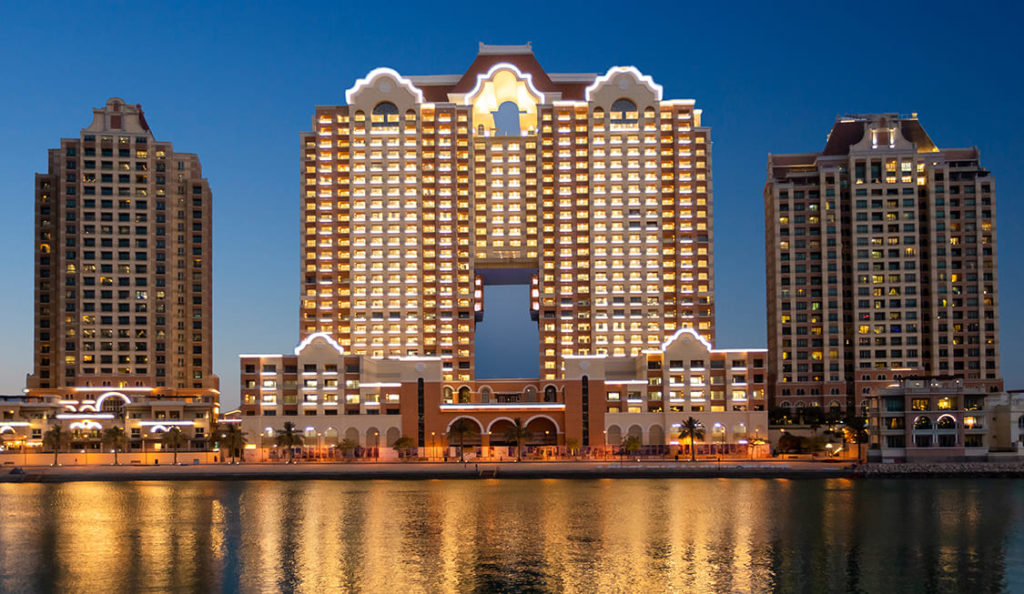 Tower in Qatar shining in the evening