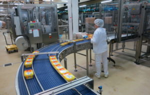 Assembly line work in a production hall for butter