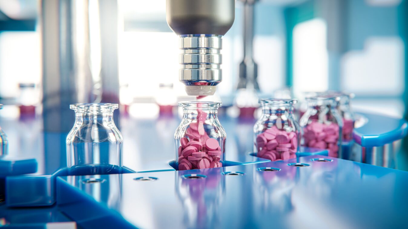 A filling machine for tablets fills a certain quantity of tablets into jars.